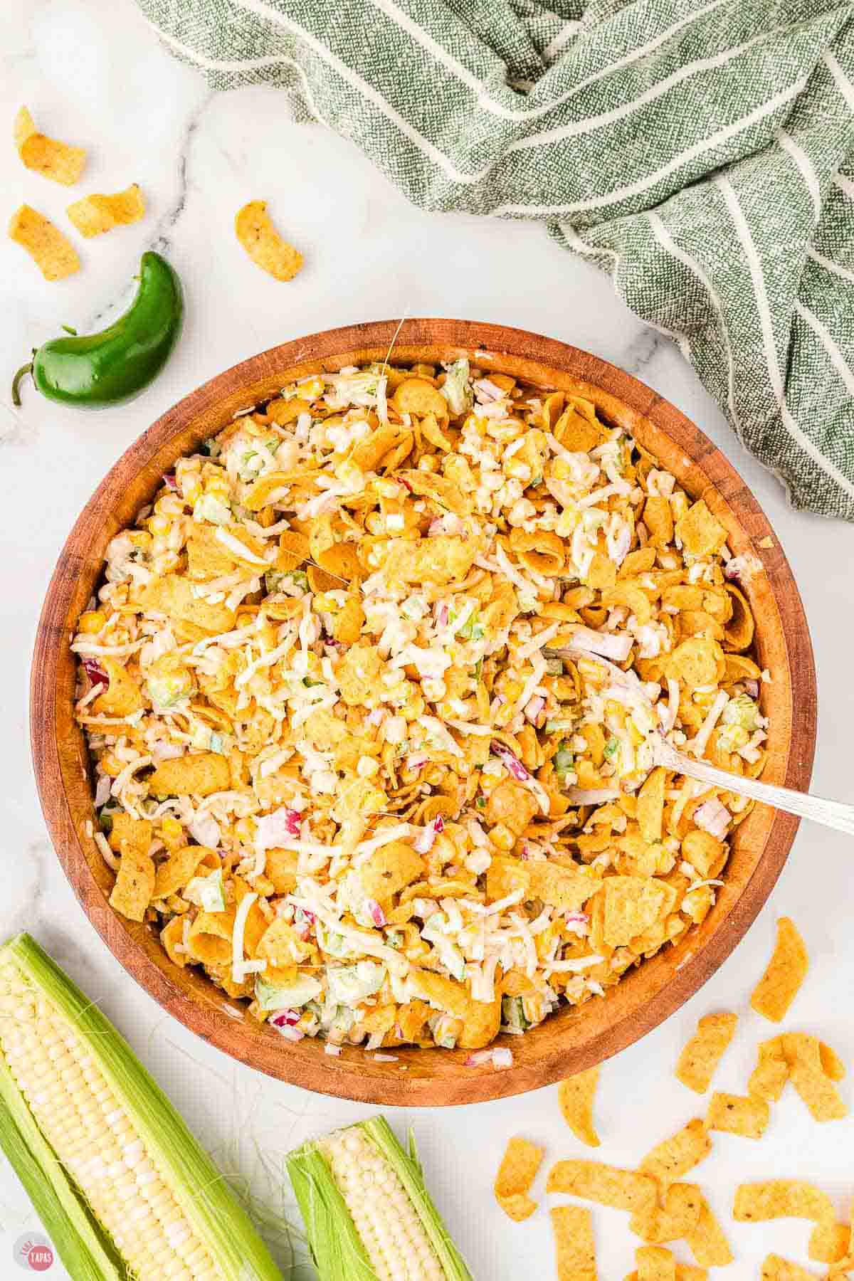 bowl of frito corn salad with a spoon in it