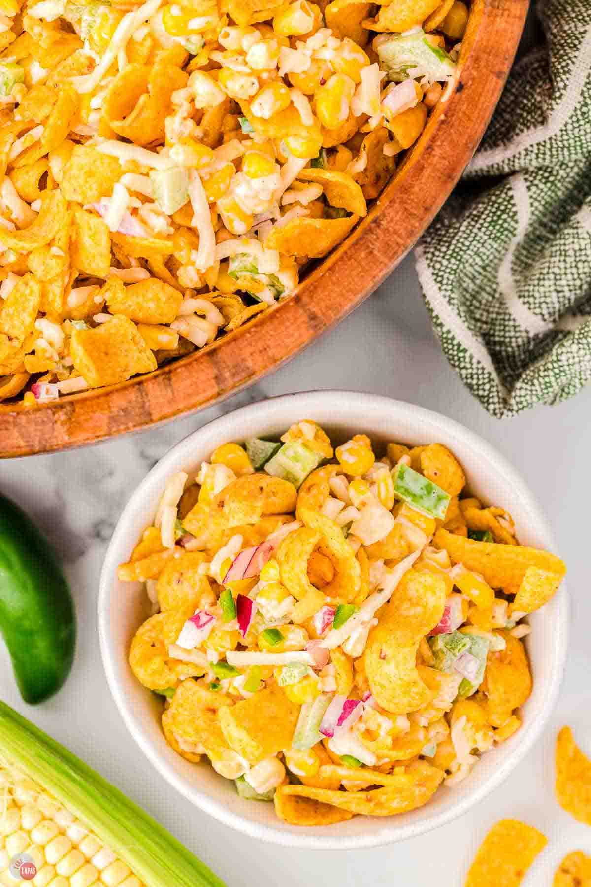 two bowls of salad on a table