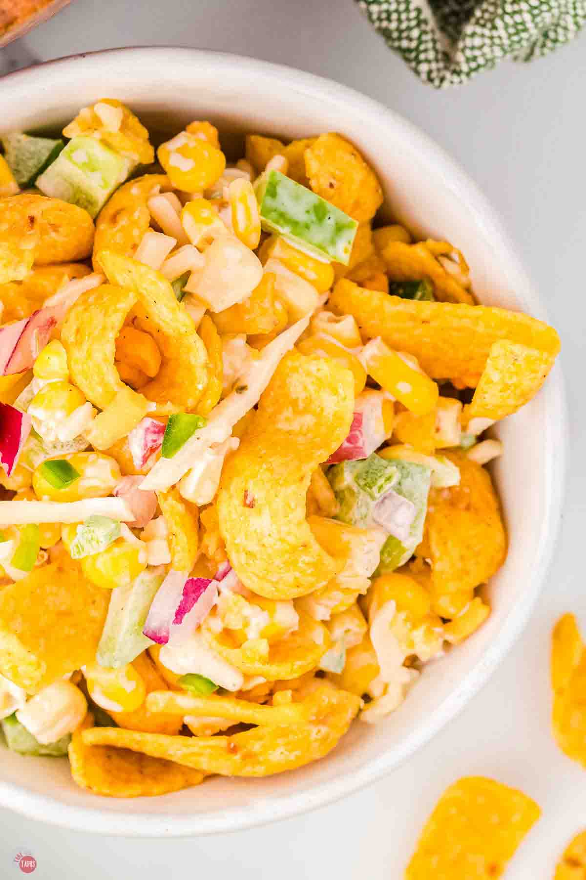 close up of corn salad with crushed frito chips