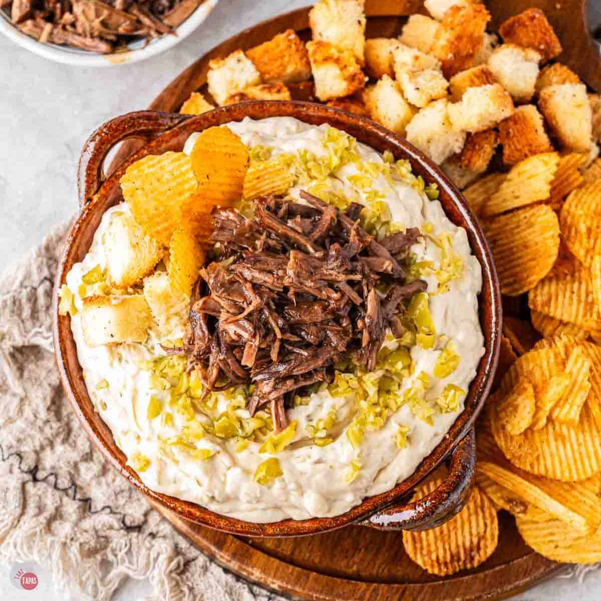 bowl of meaty dip with bread cubes