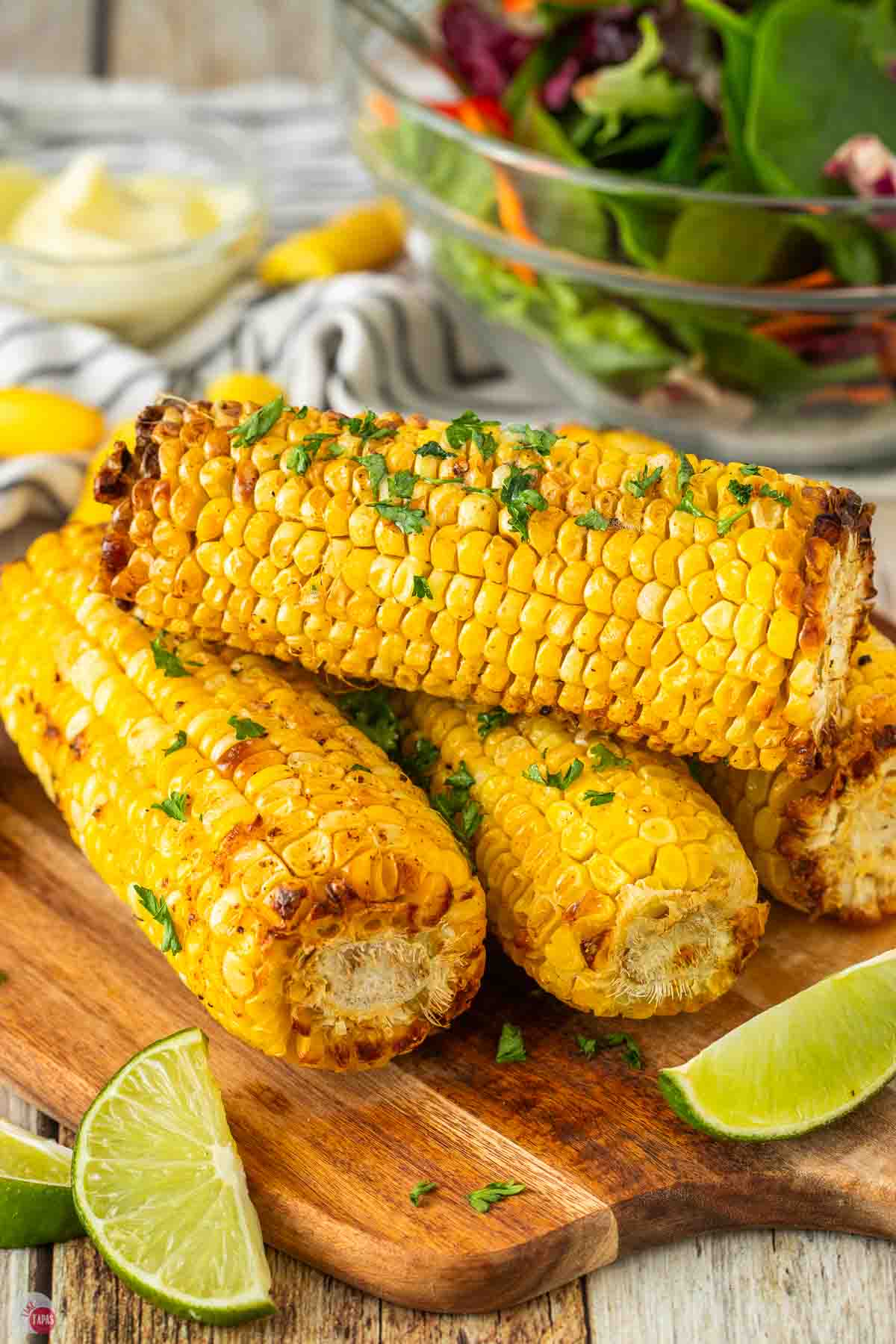 stack of corn on the cob on a wood board