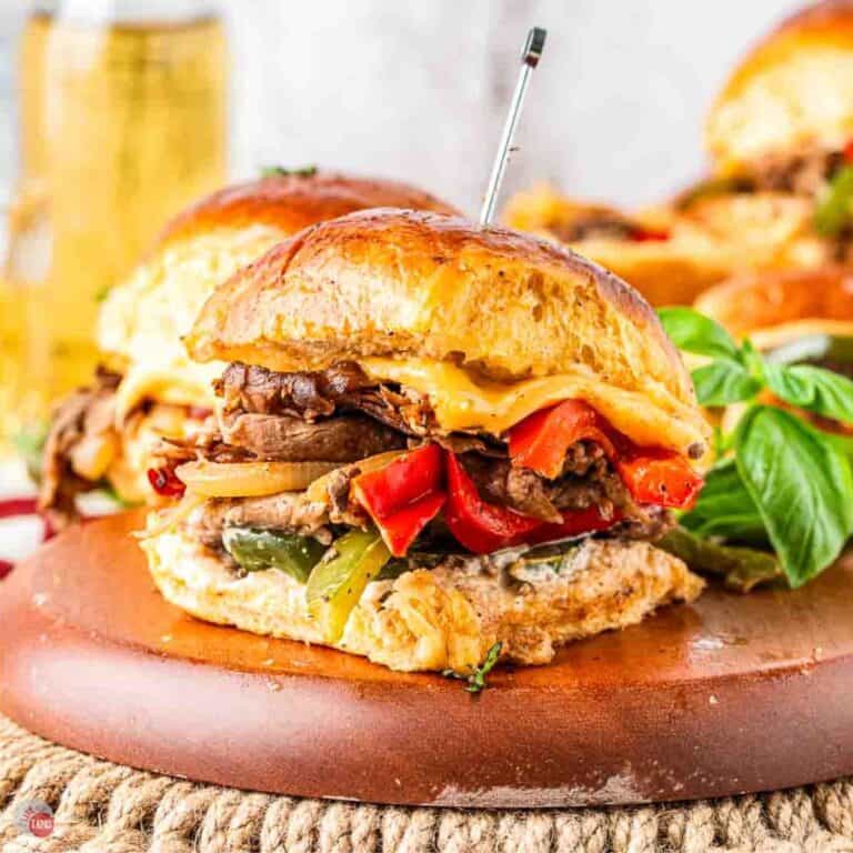 philly cheesesteak slider on a wood board