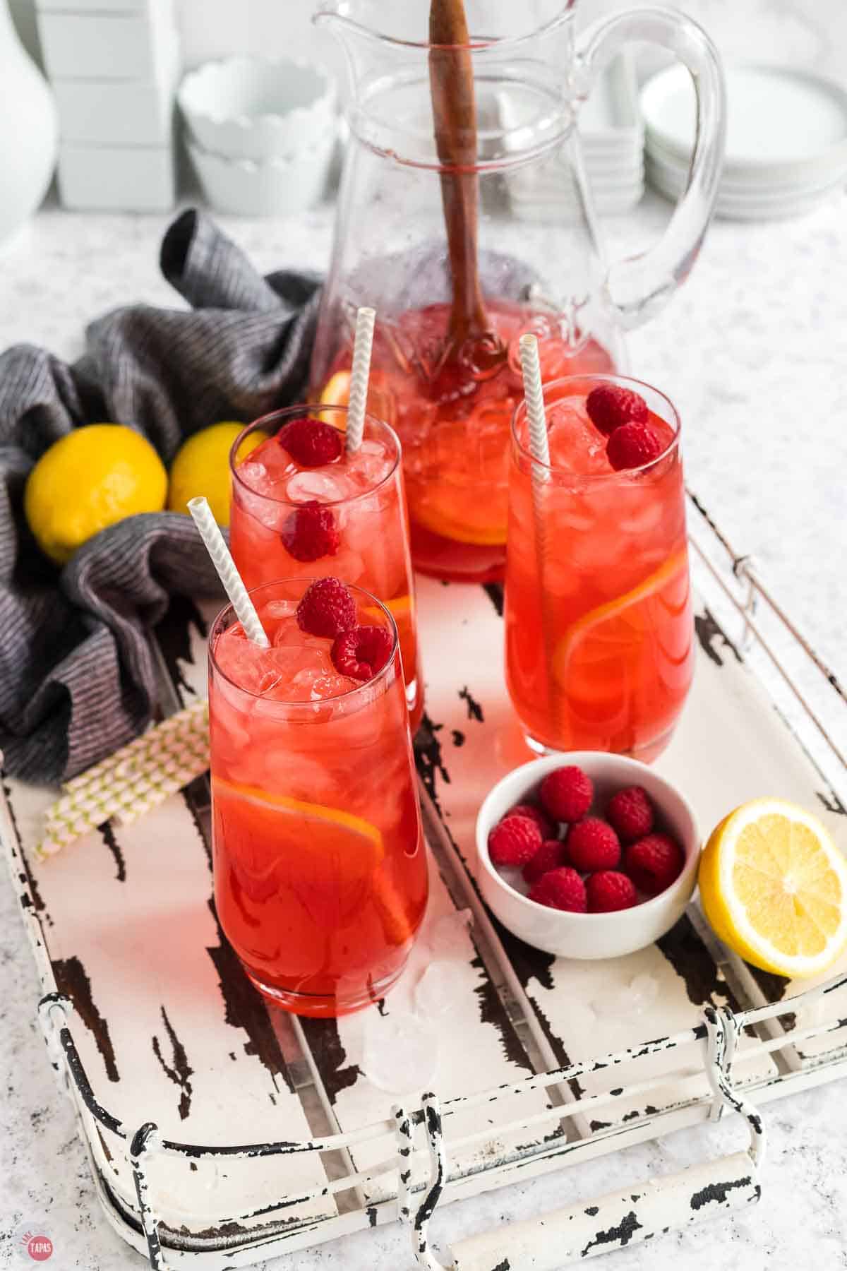 tray of glasses with fruit tea