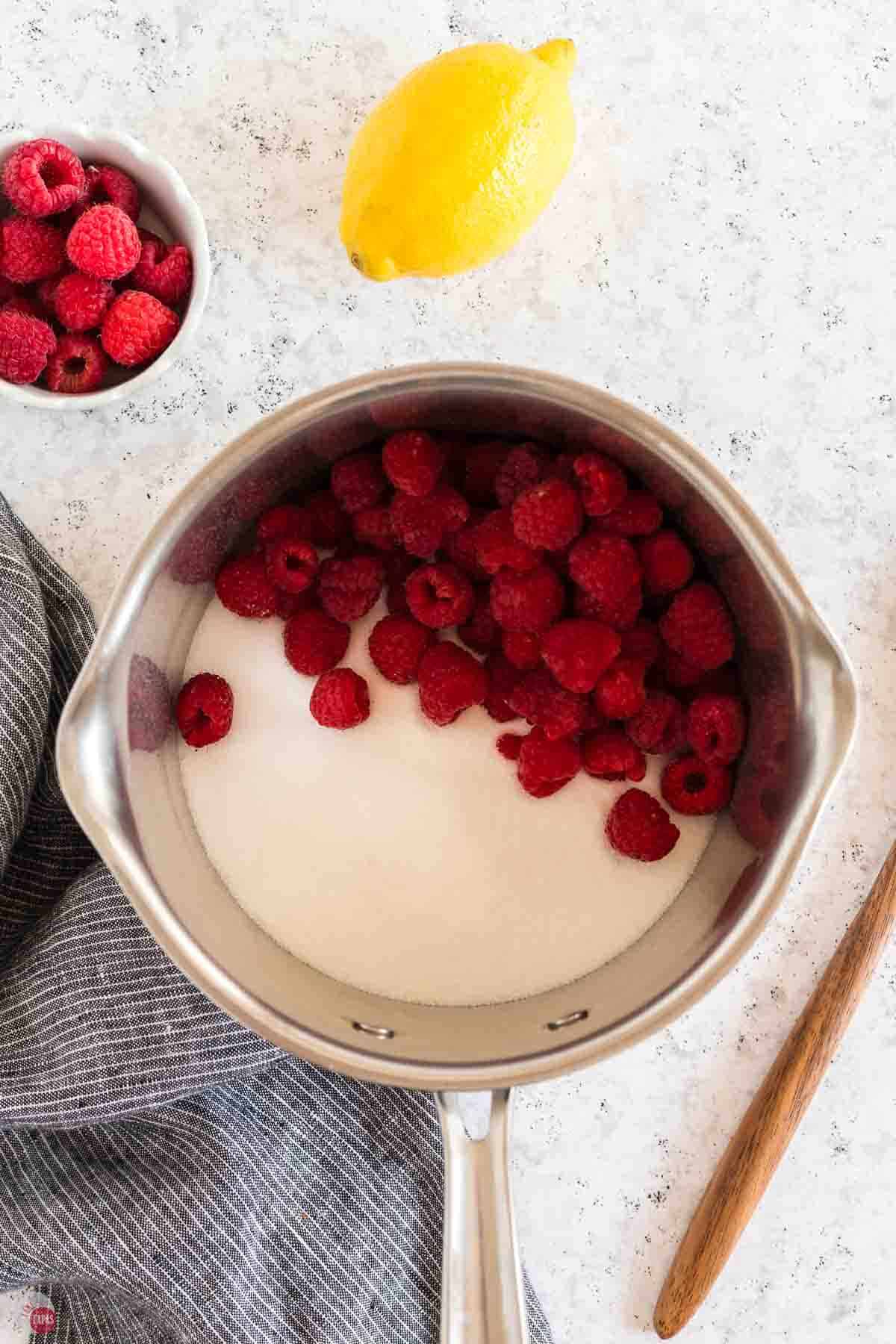 frozen raspberries and sugar in a pot