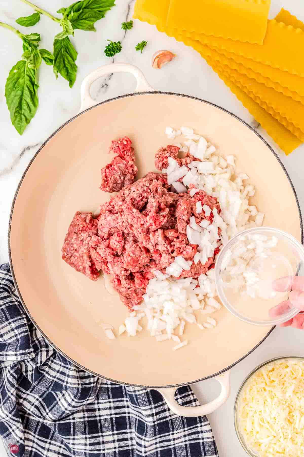ground beef and onion cooking in a skillet