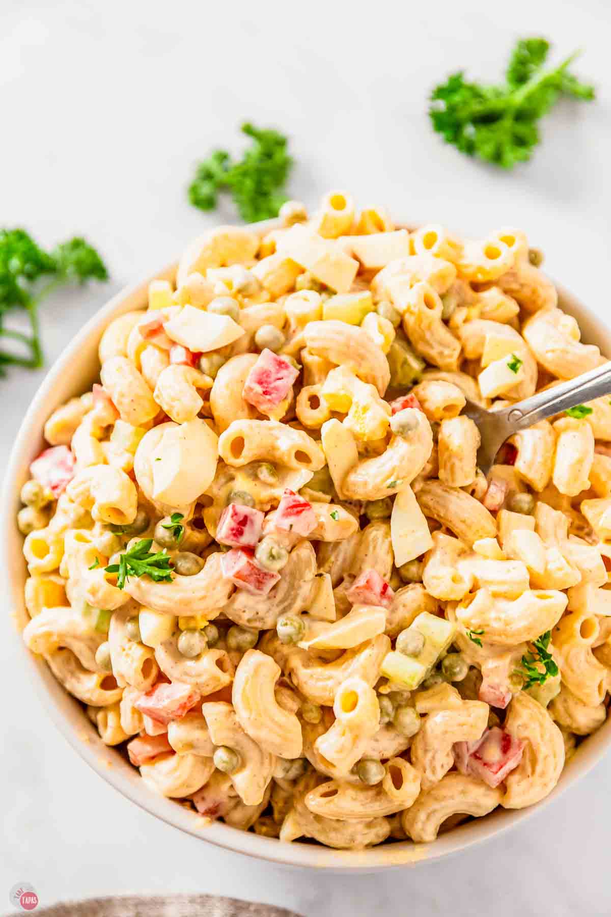 pasta salad with creamy dressing with a spoon