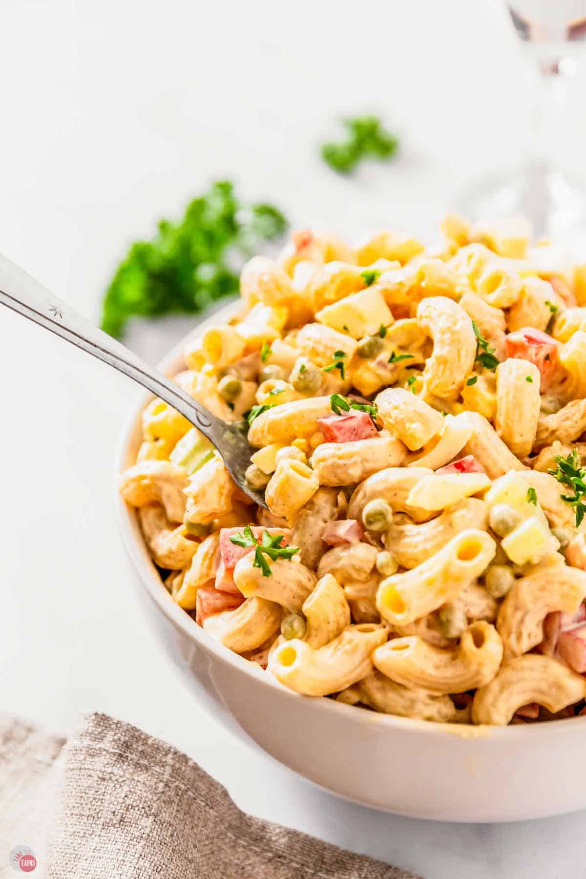 spoon with bite of pasta salad