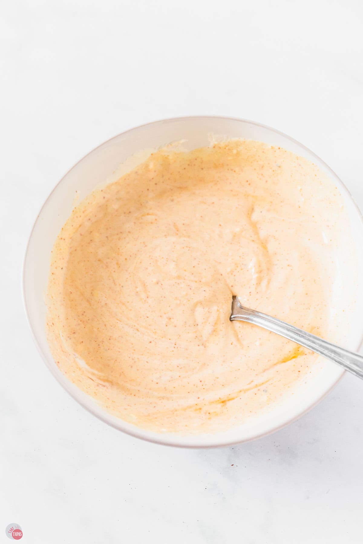 pasta salad dressing in s white bowl