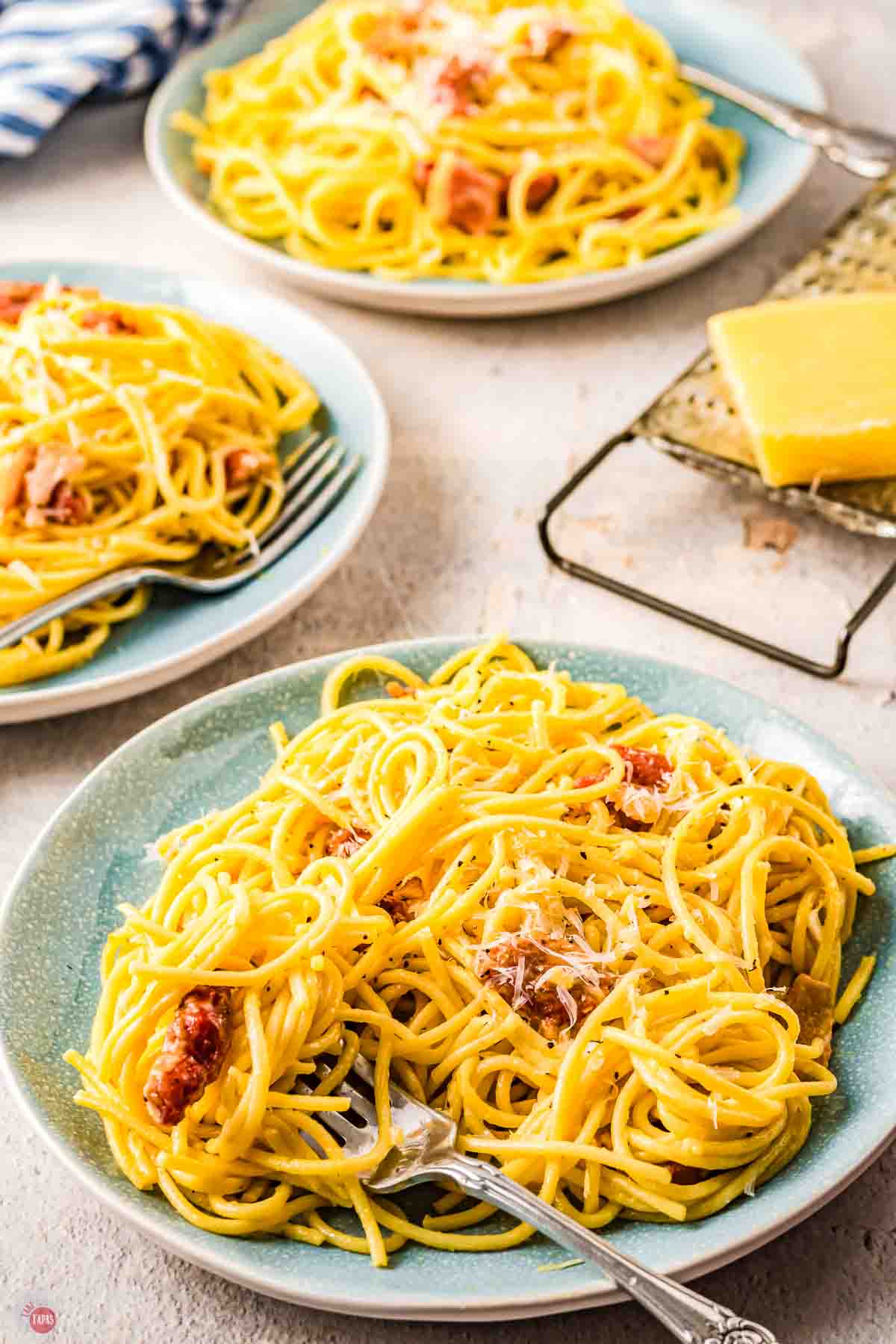 three plates of pasta