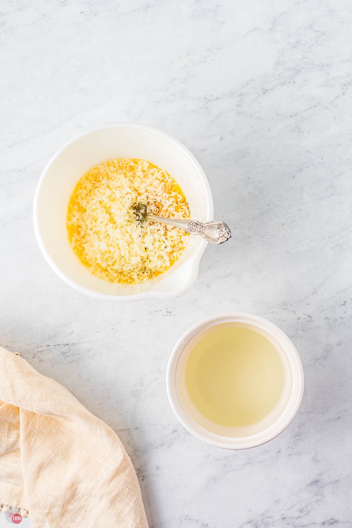 two bowls of cheese with eggs mixed in
