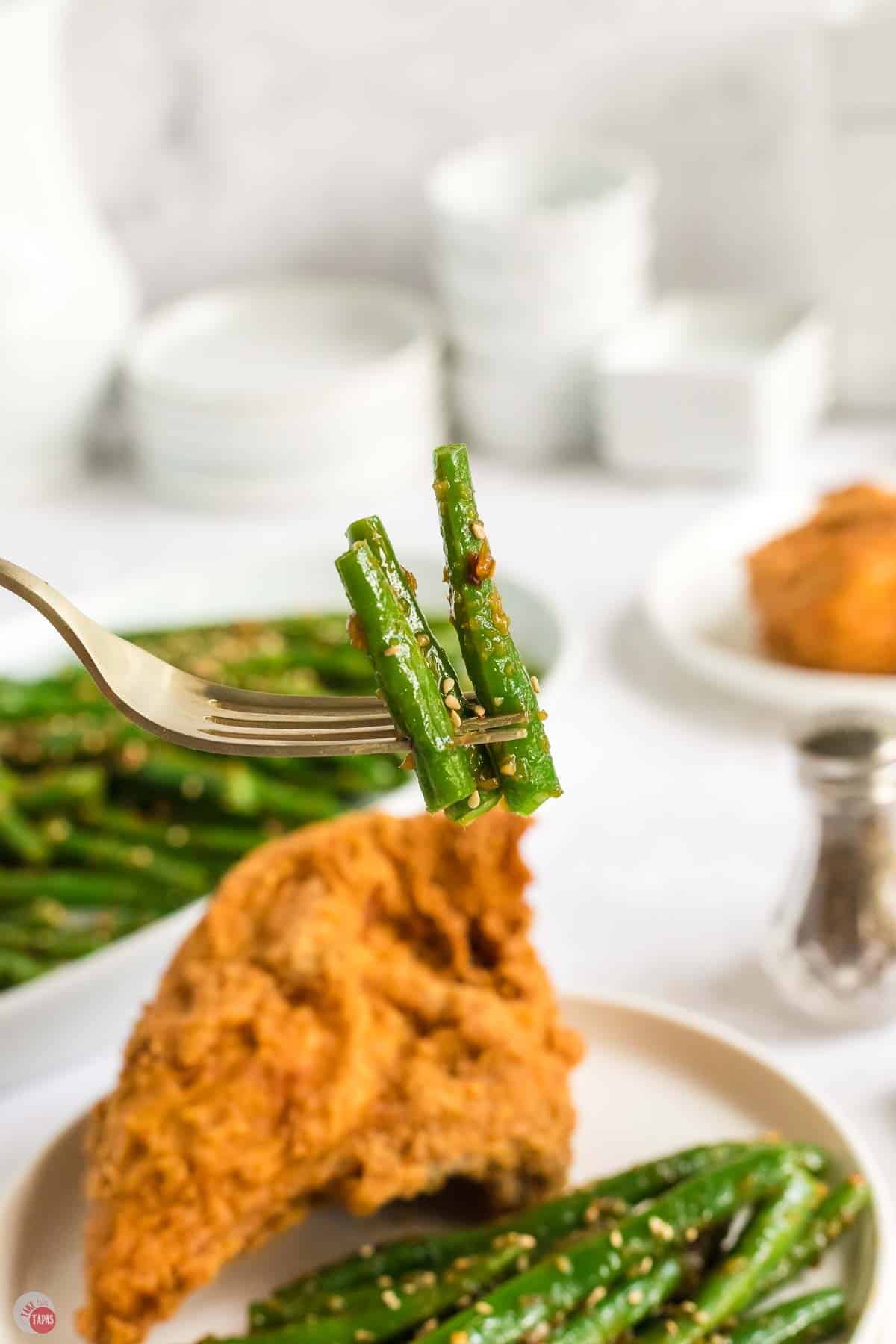fork with bite of garlic green beans on it