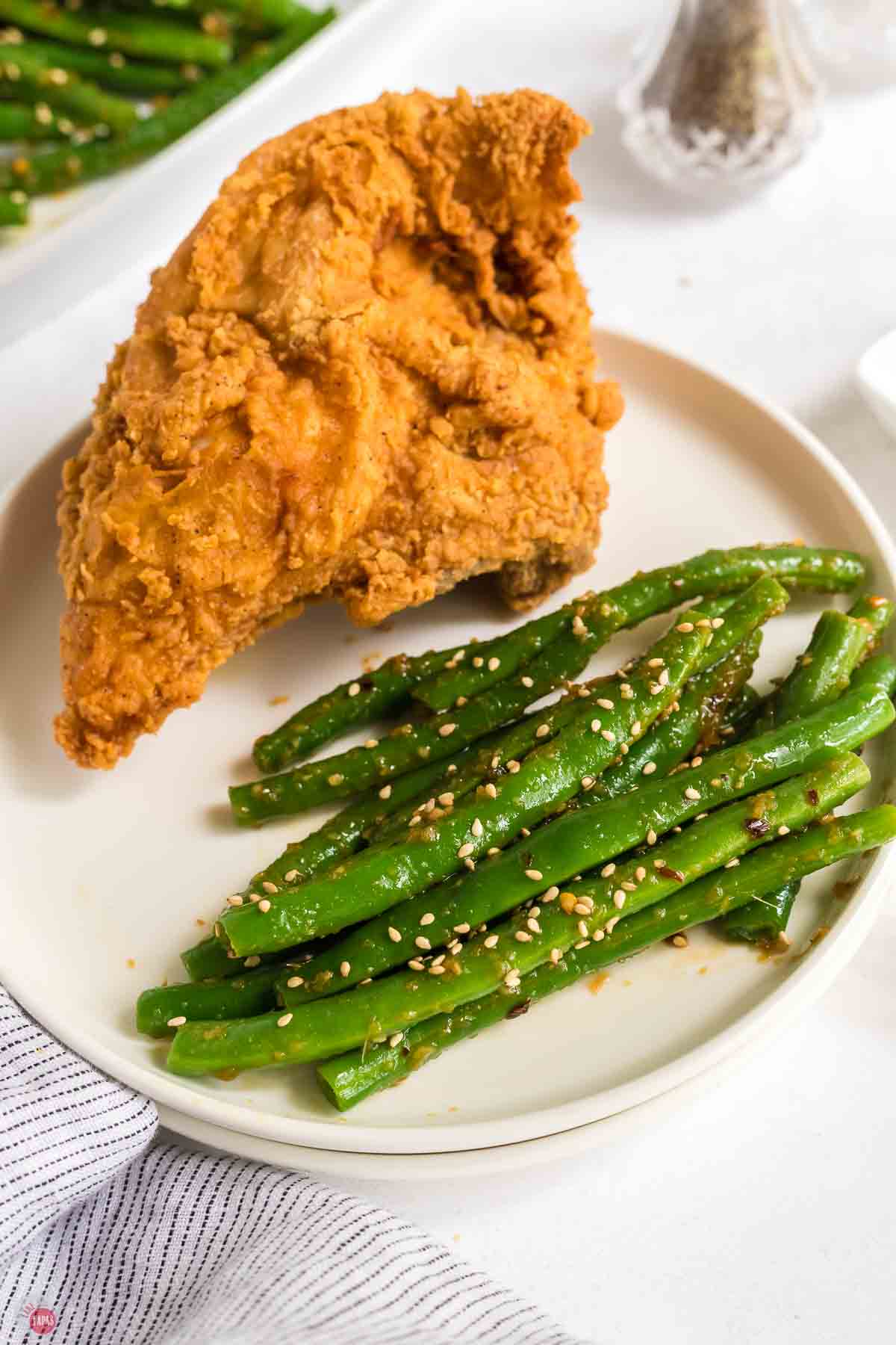 plate of green beans with fried chicken