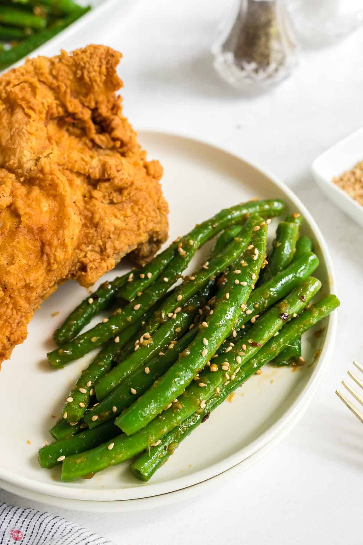 plate of fried chicken and  crispy green beans