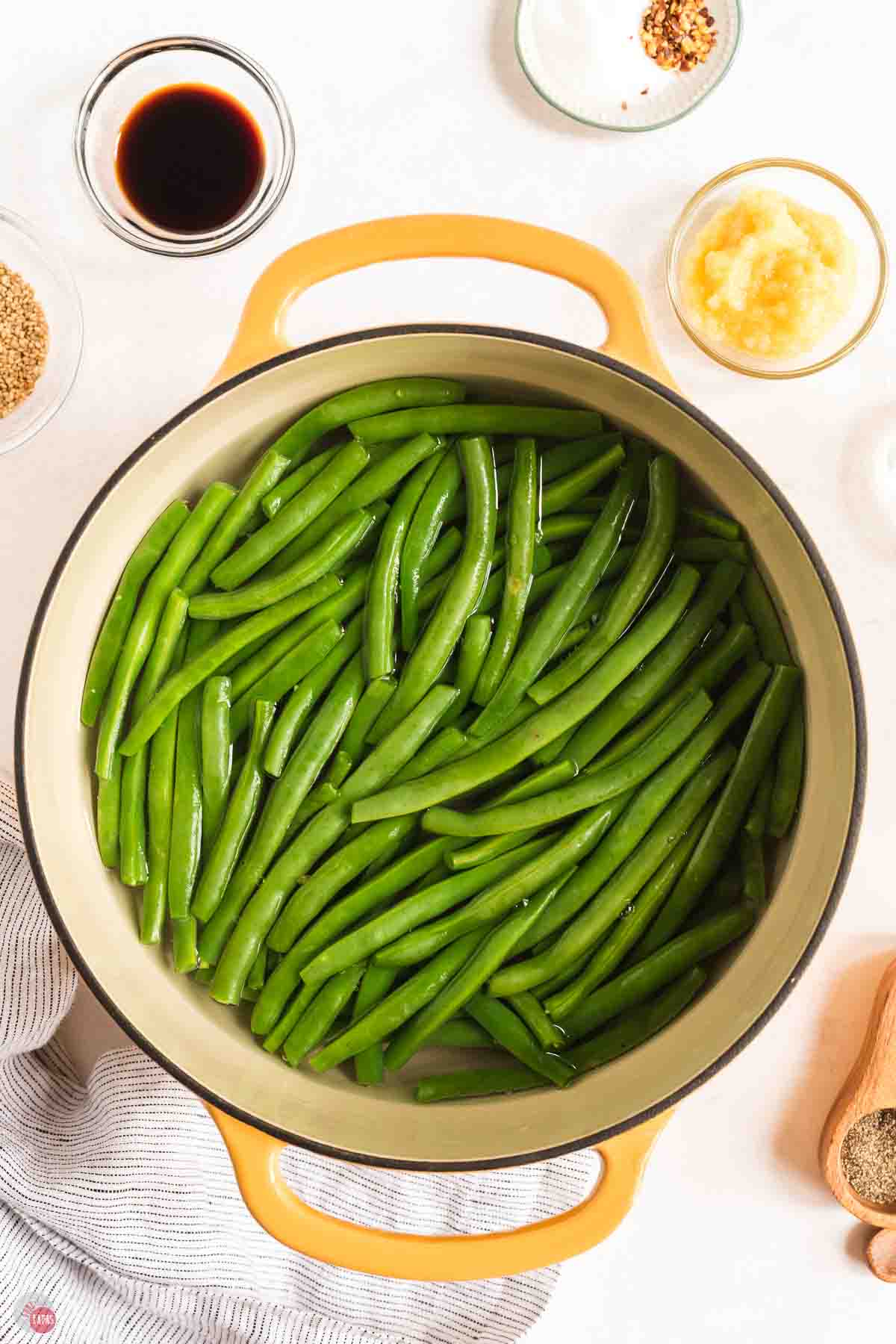 green beans cooking in a large yellow pot
