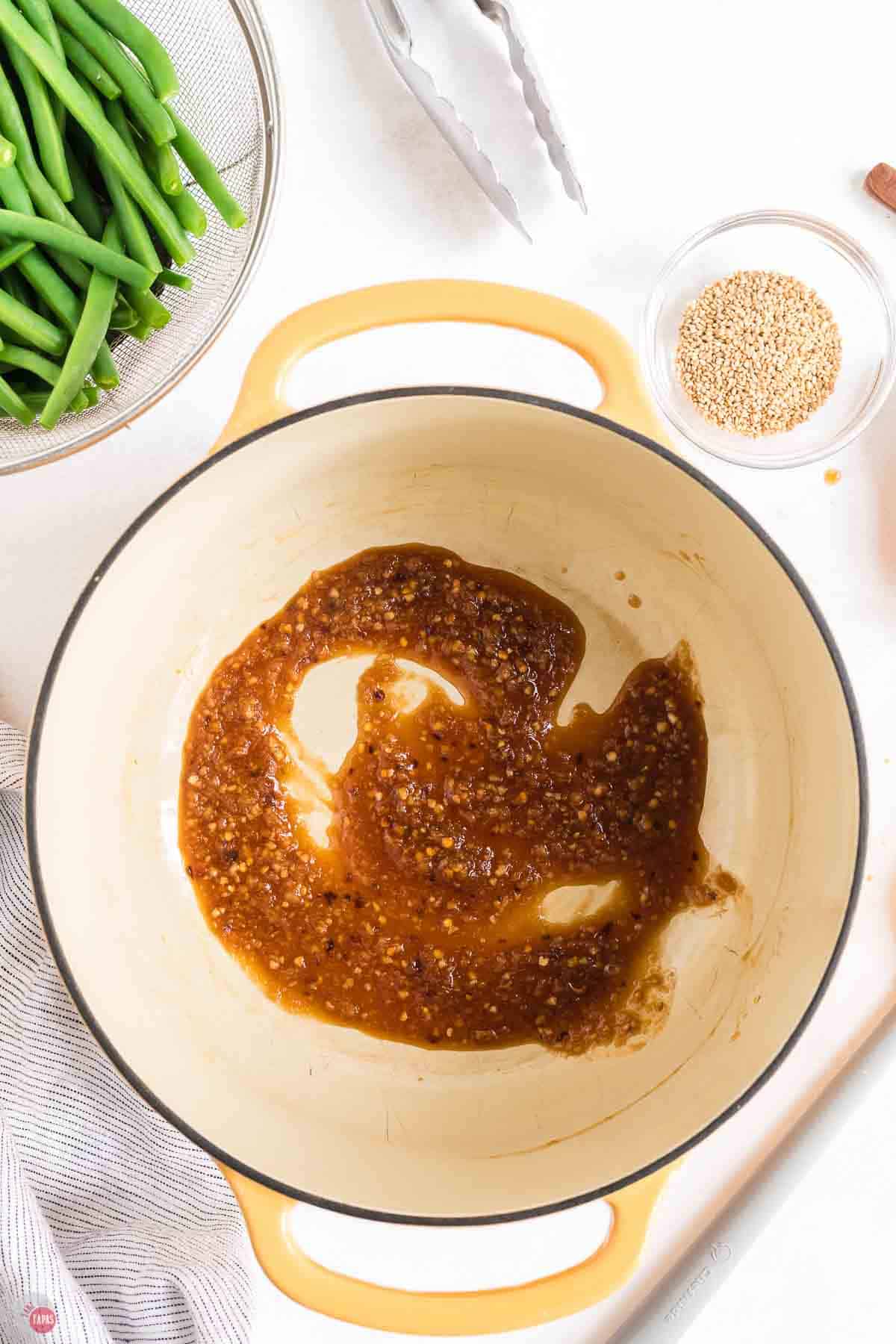 garlic ginger sauce cooking in a yellow pot