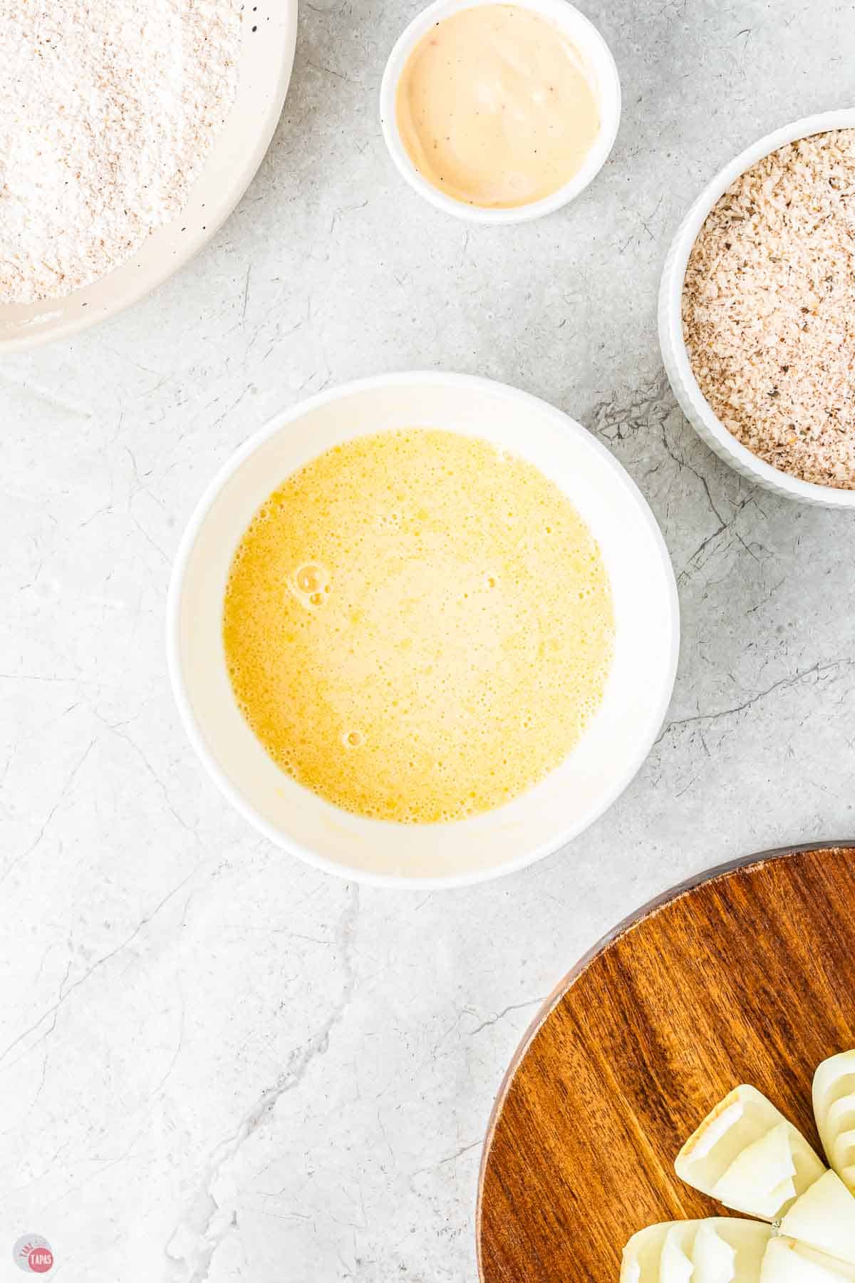 egg wash in a white bowl
