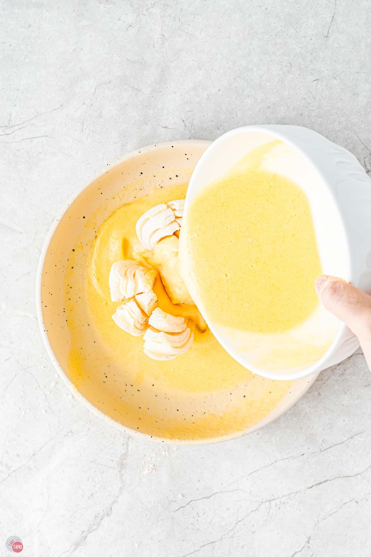 egg wash bring poured over a cut onion