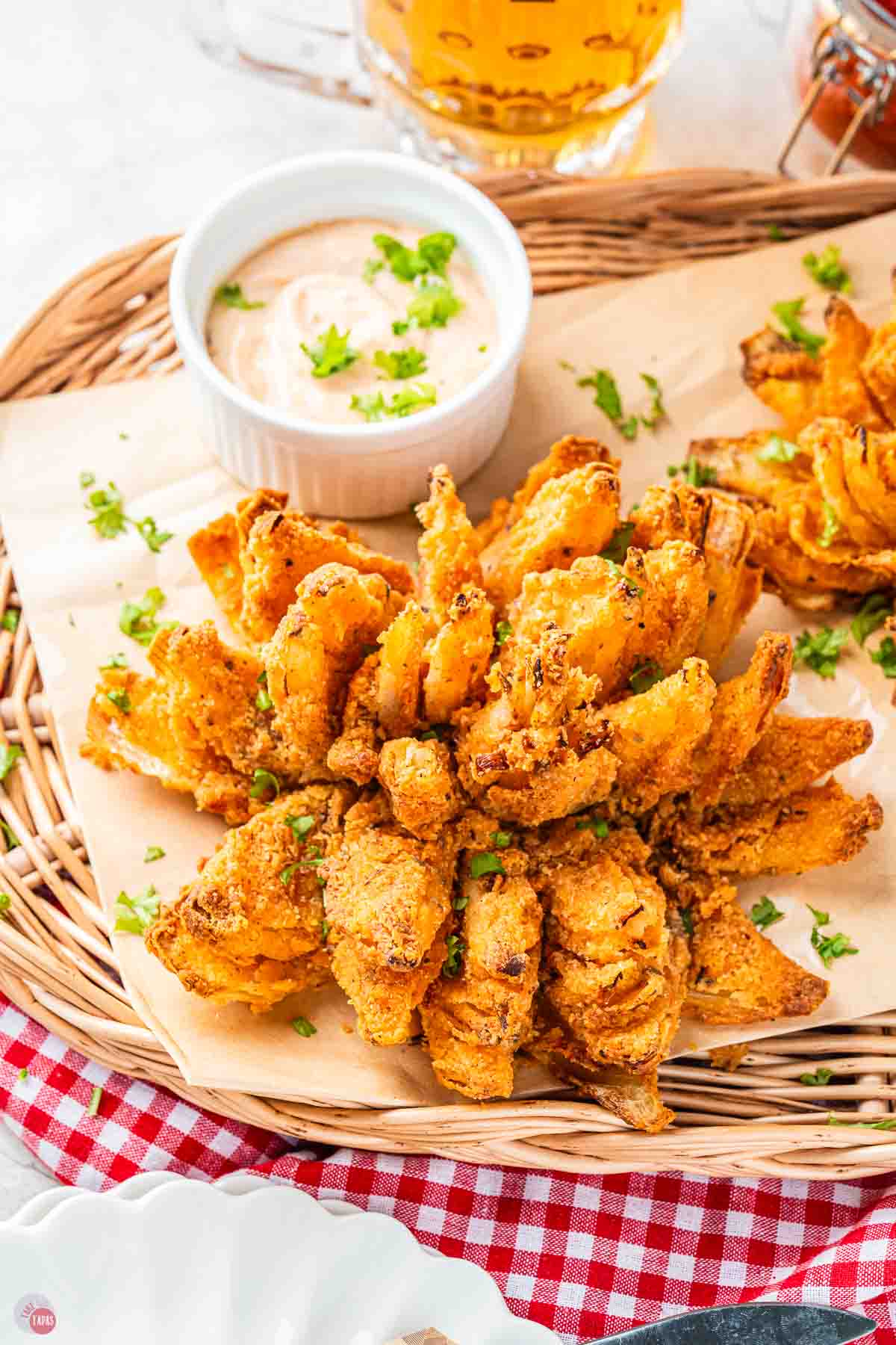 air fryer blooming onion on a napkin