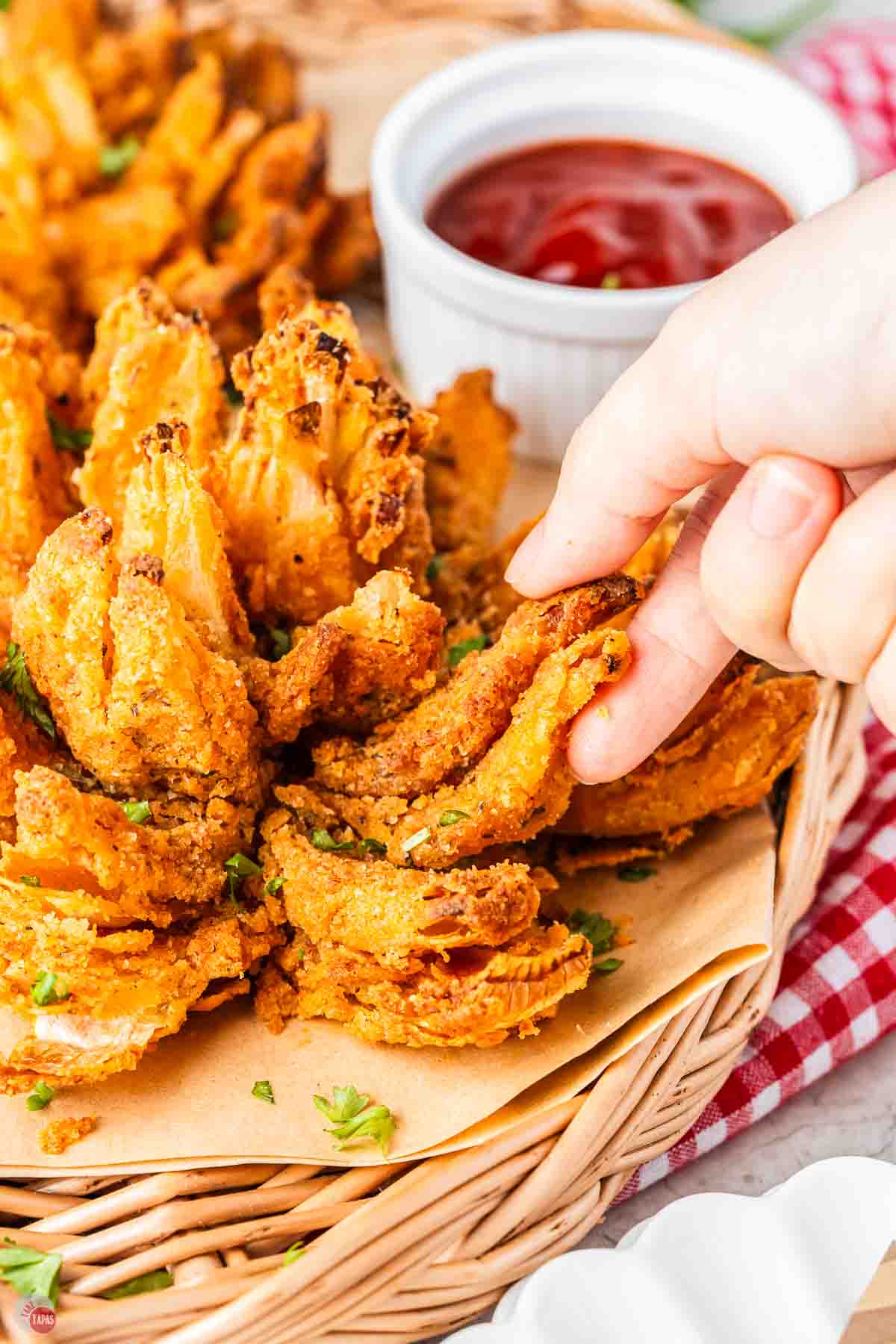 hand grabbing a piece of onion