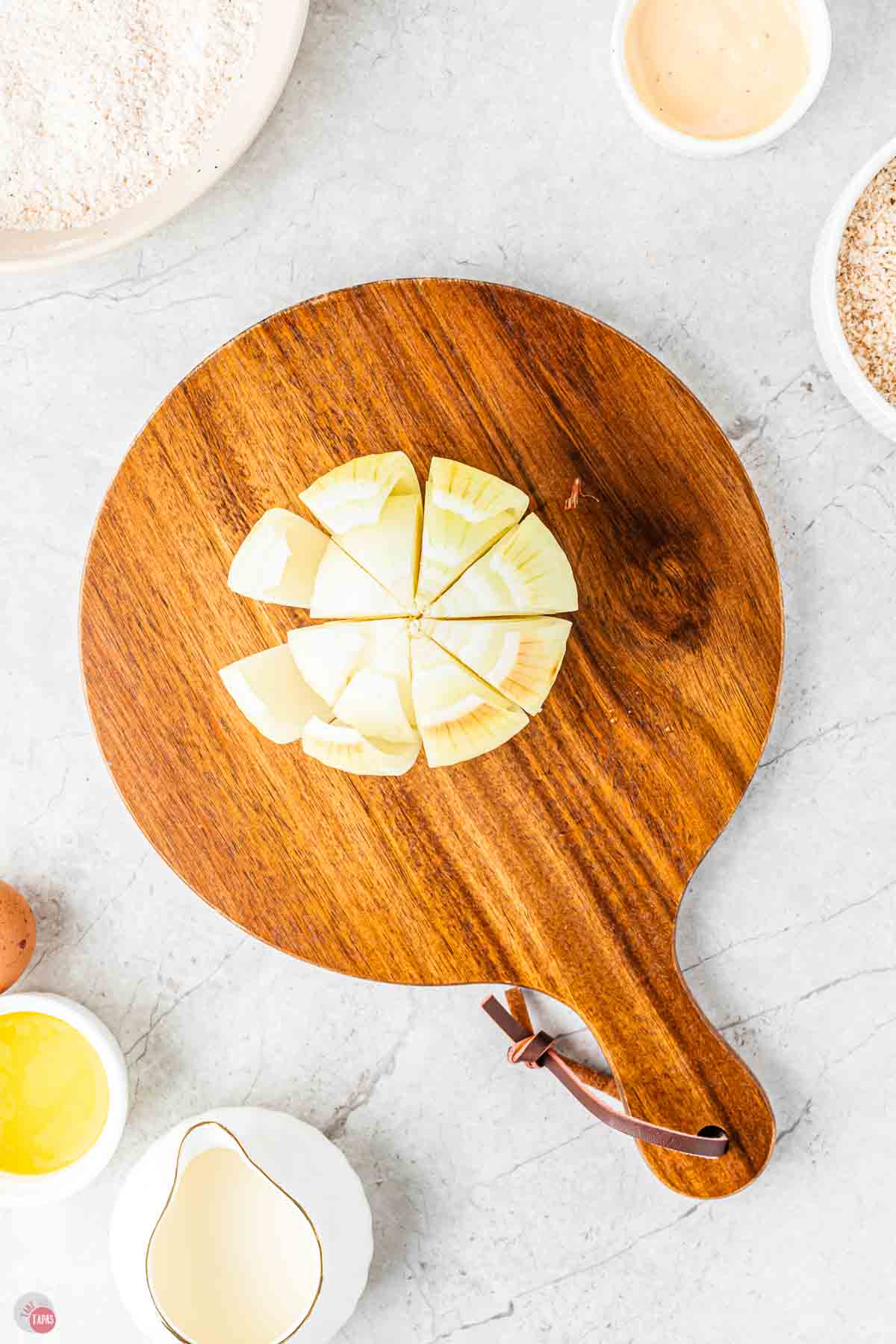onion on a cutting board with the layers flaring open