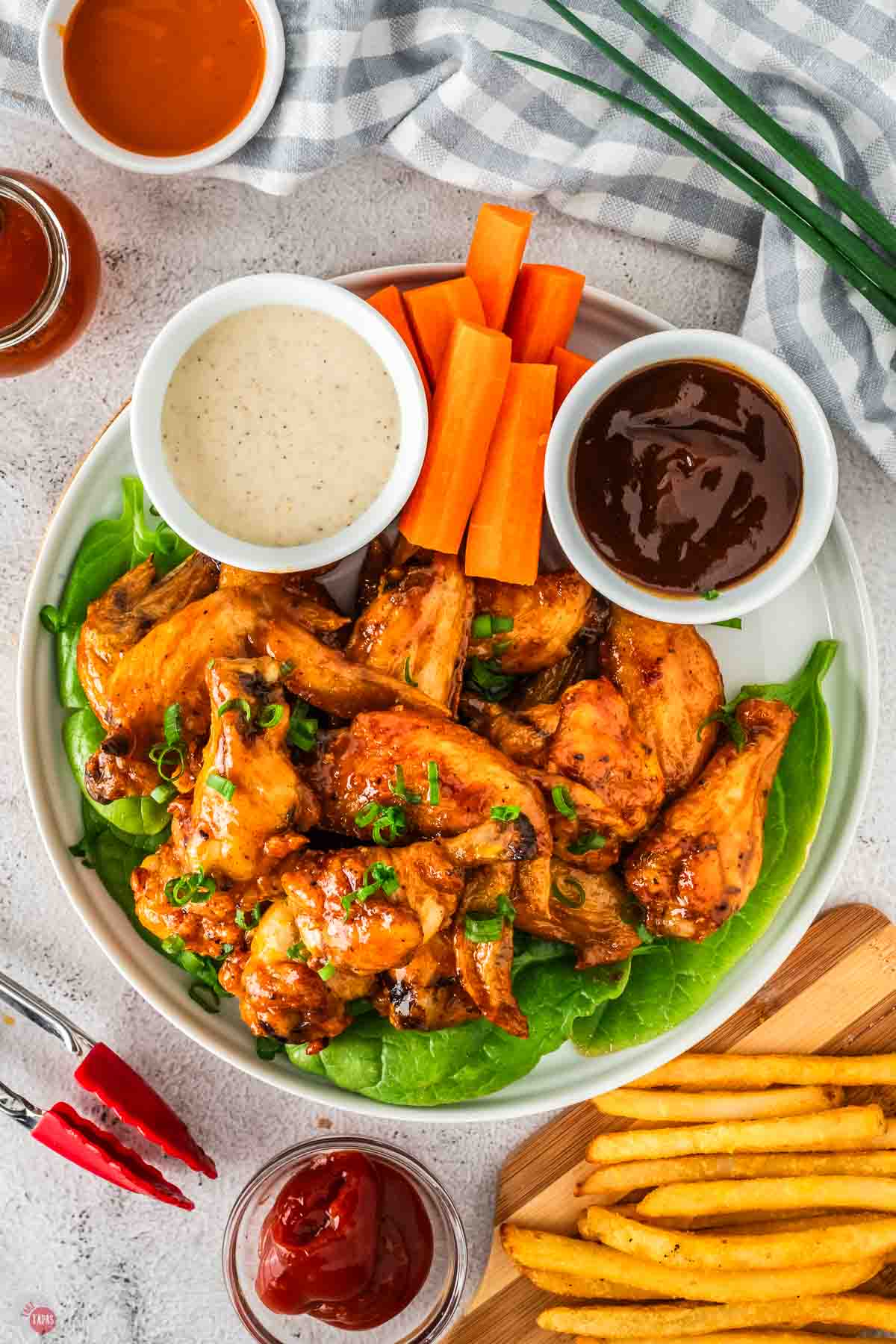 plate of chicken wings with ranch dressing