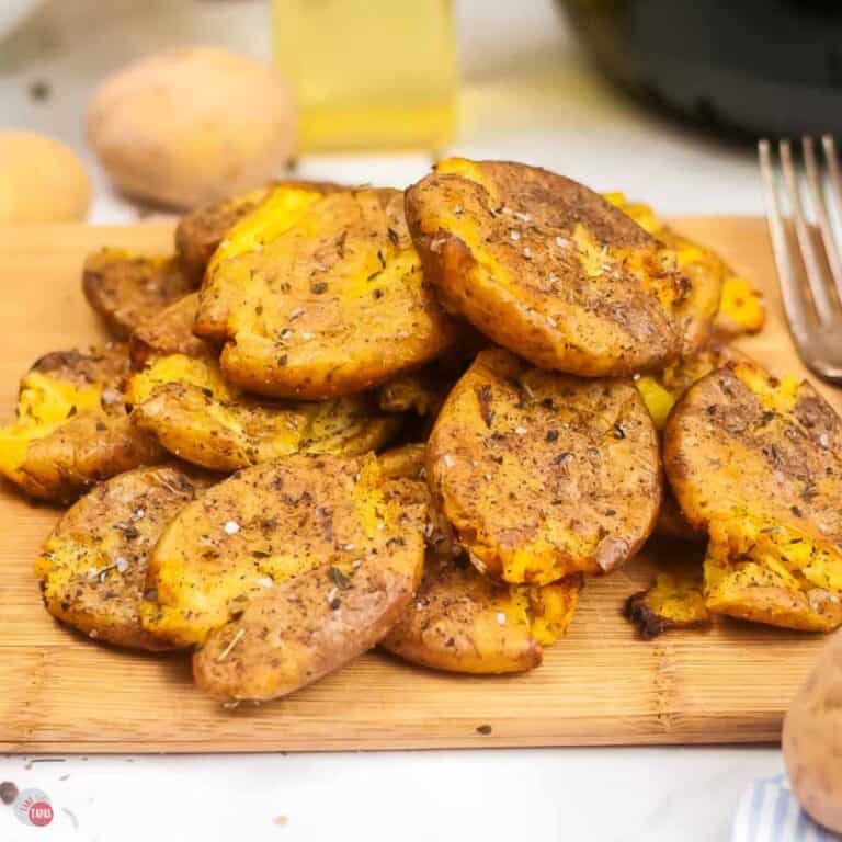 pile of smashed potatoes on a wood board