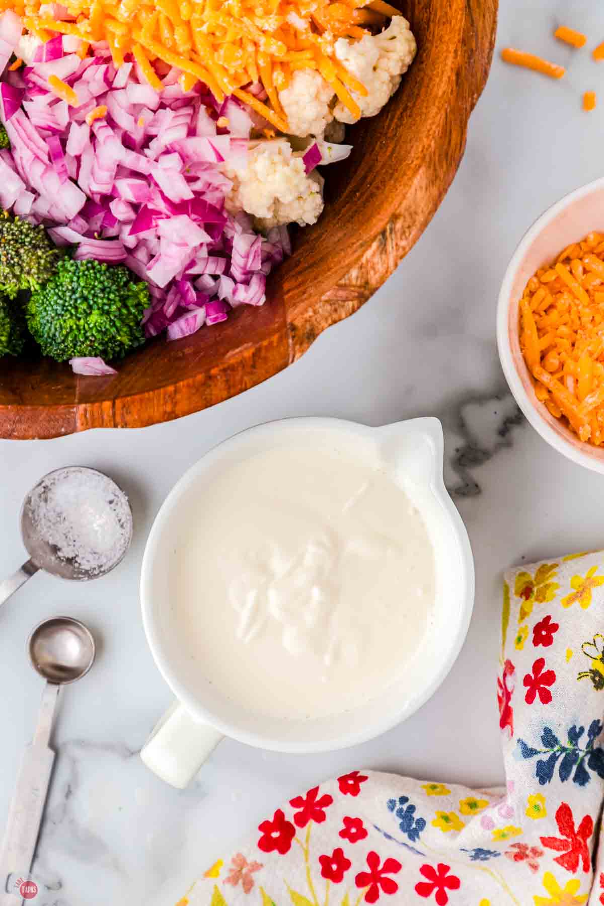 creamy dressing in a small white bowl