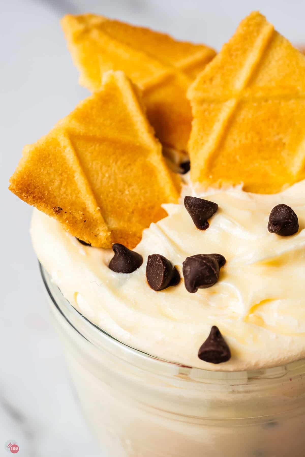 close up of creamy dessert dip with ice cream cones