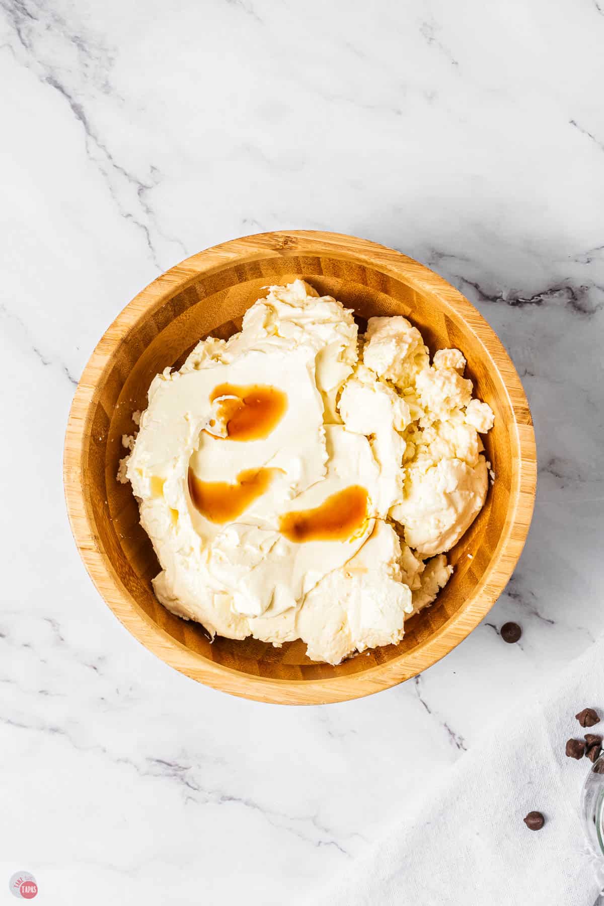 wood bowl with whipped ricotta cheese and vanilla extract