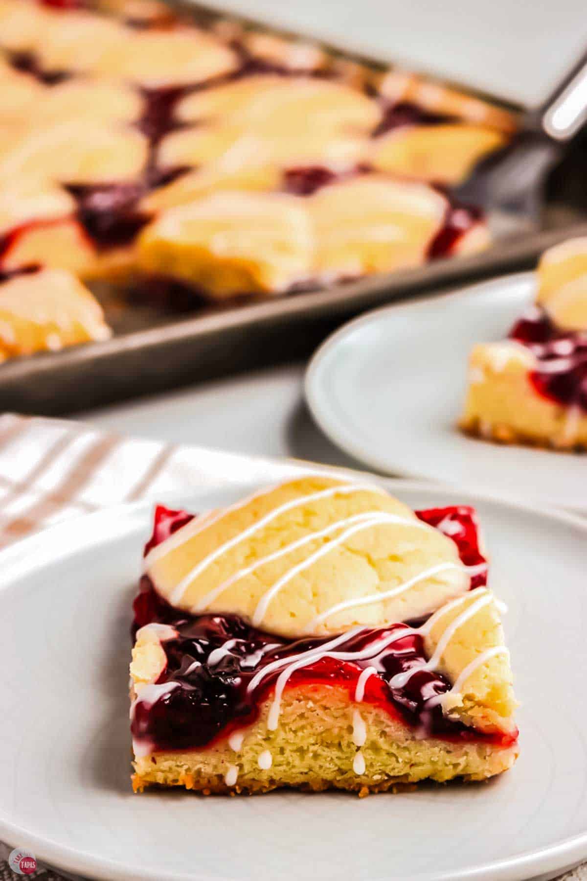 white plate with a cherry pie bar on it
