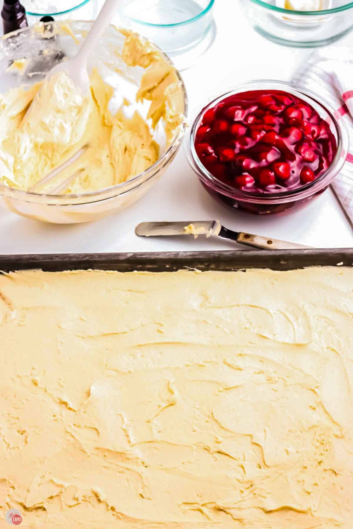 cookie dough being spread in a jelly roll pan