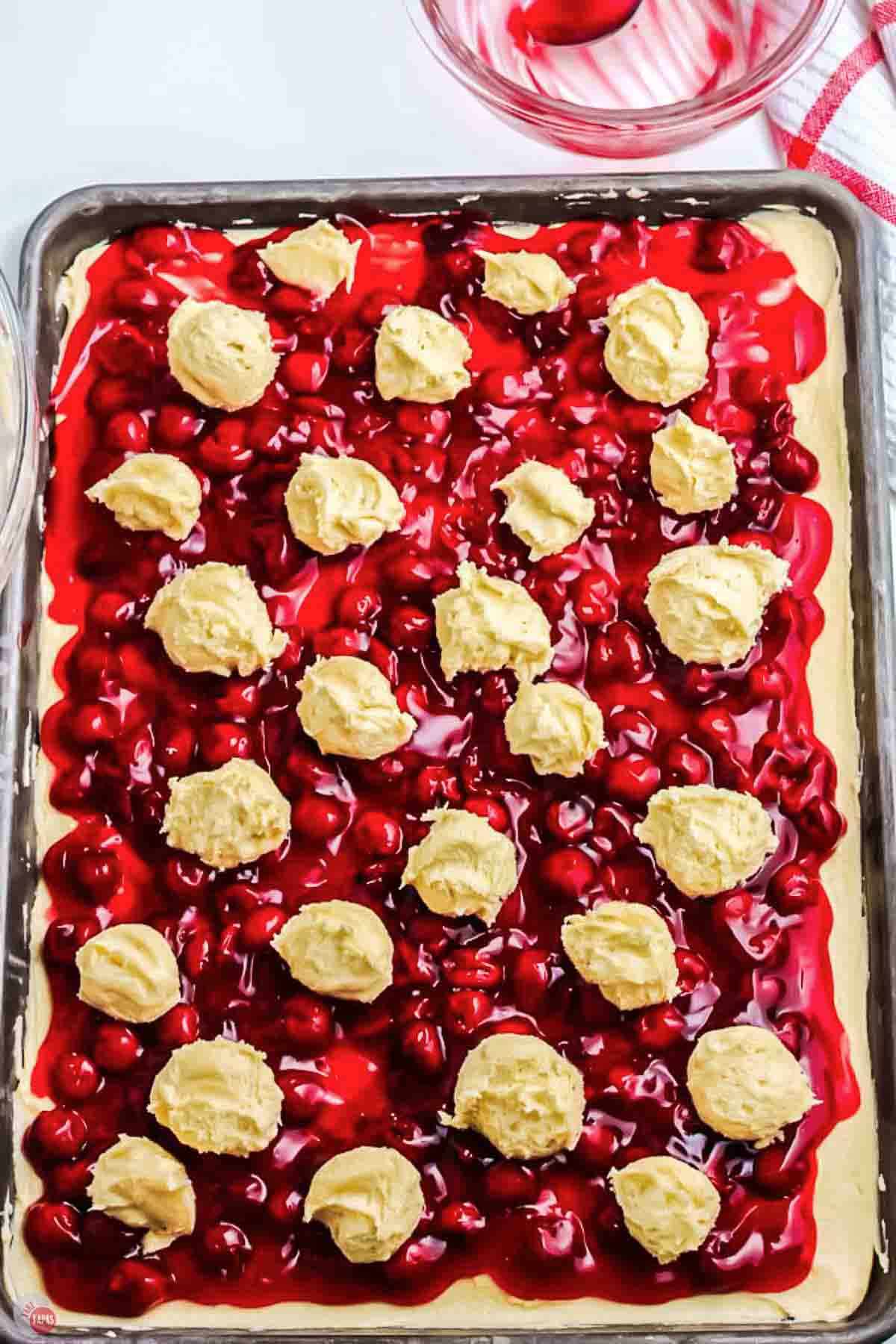 unbaked cherry pie bars on a baking ray