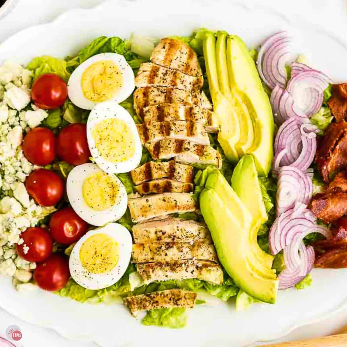 chicken cobb salad on a white platter