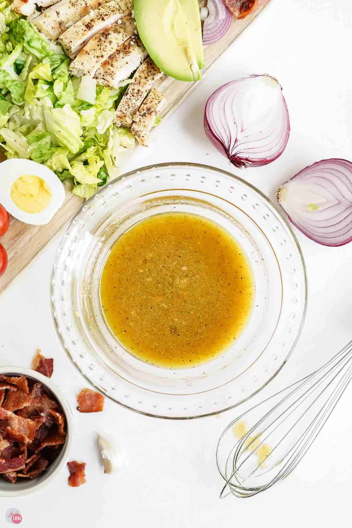 clear bowl of salad dressing