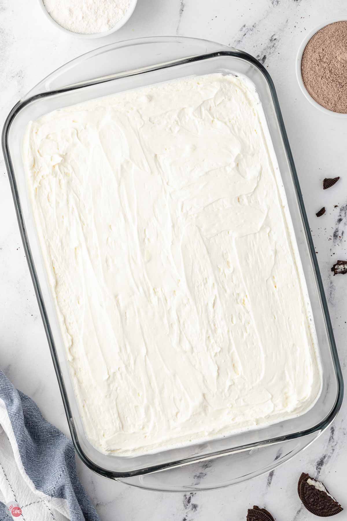 whipped cream layer spread in a 9x13 dish