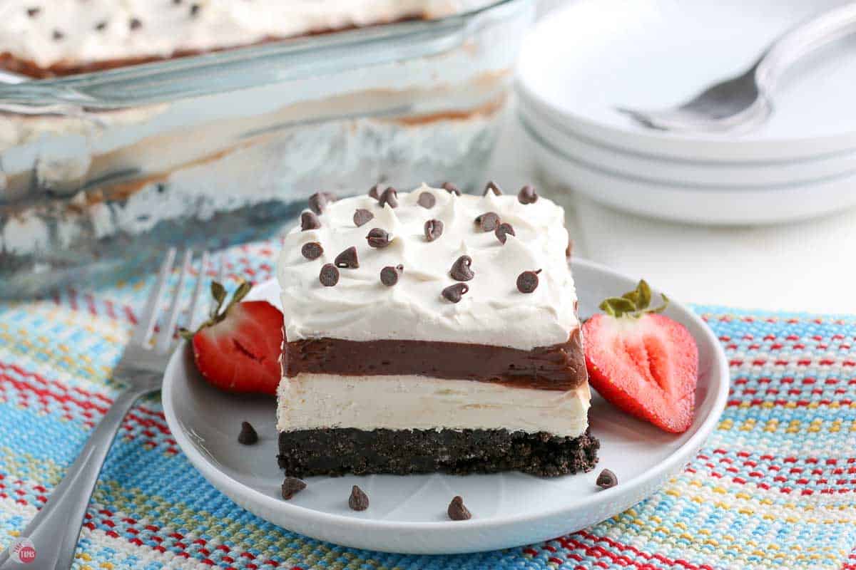 plate with a slice of no bake dessert on a blue napkin