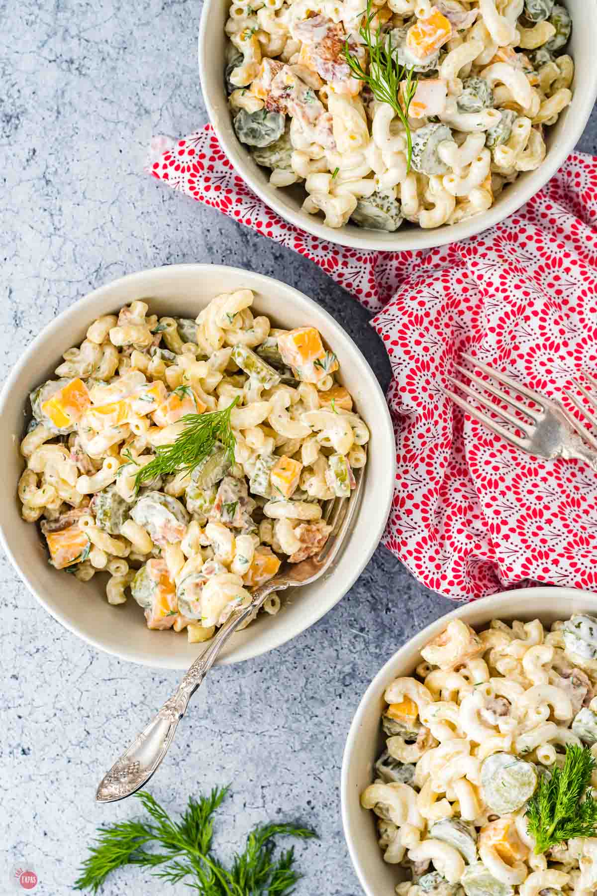 three bowls of pasta salad