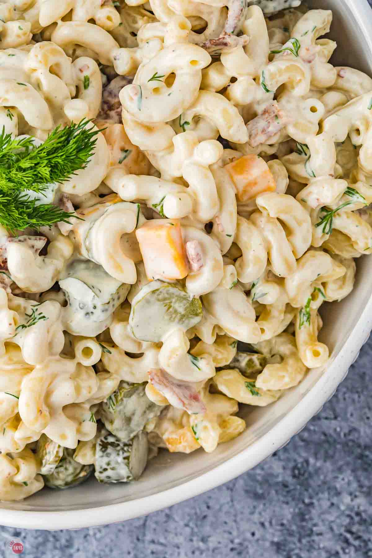 close up of pickle pasta salad with cheese