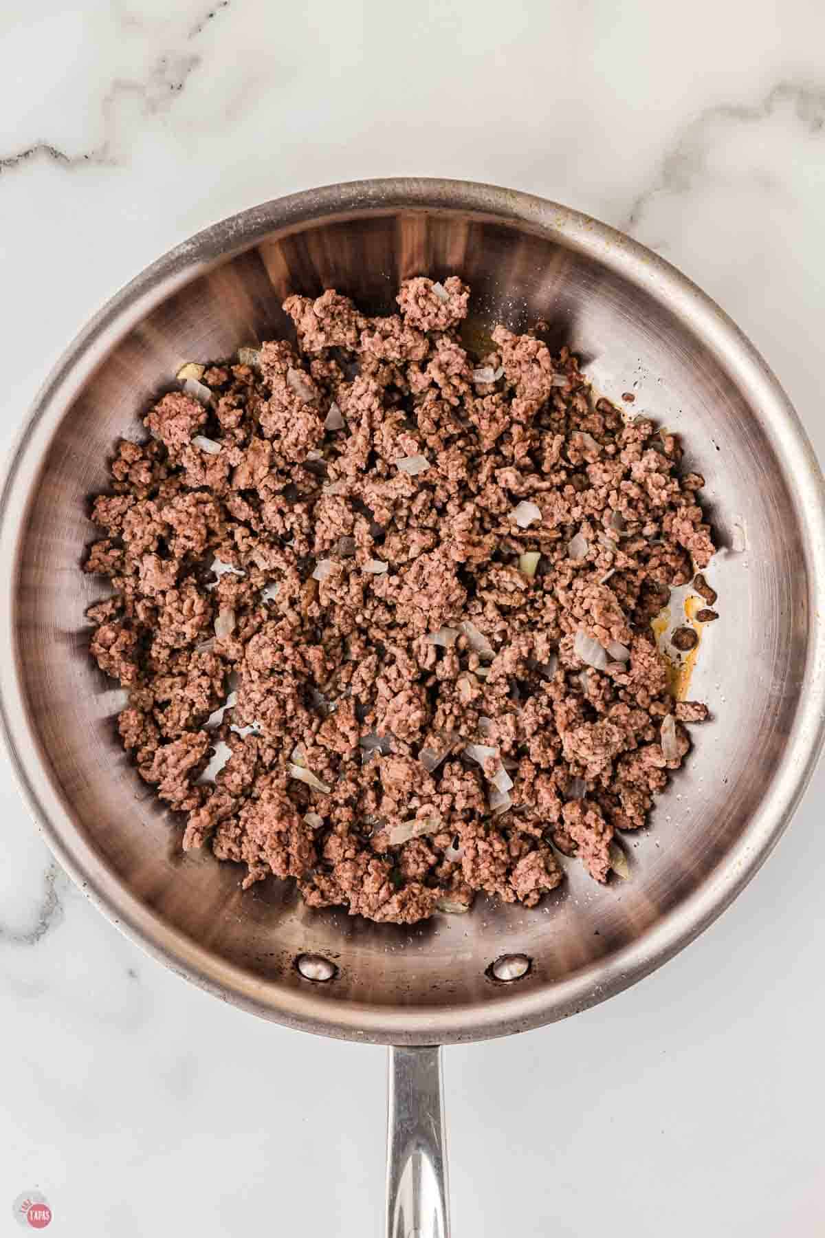 cooked ground beef in a skillet