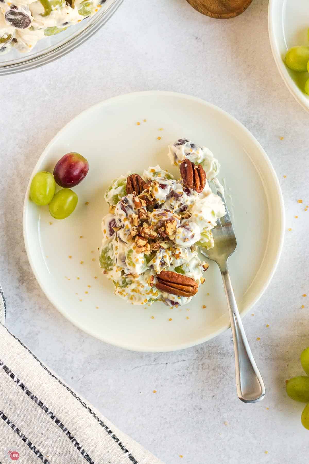 plate of grape salad with a fork