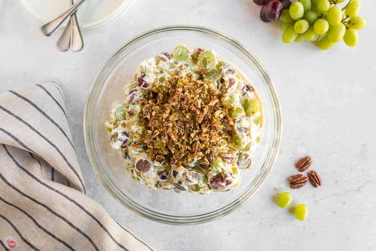 creamy grape salad in a clear bowl