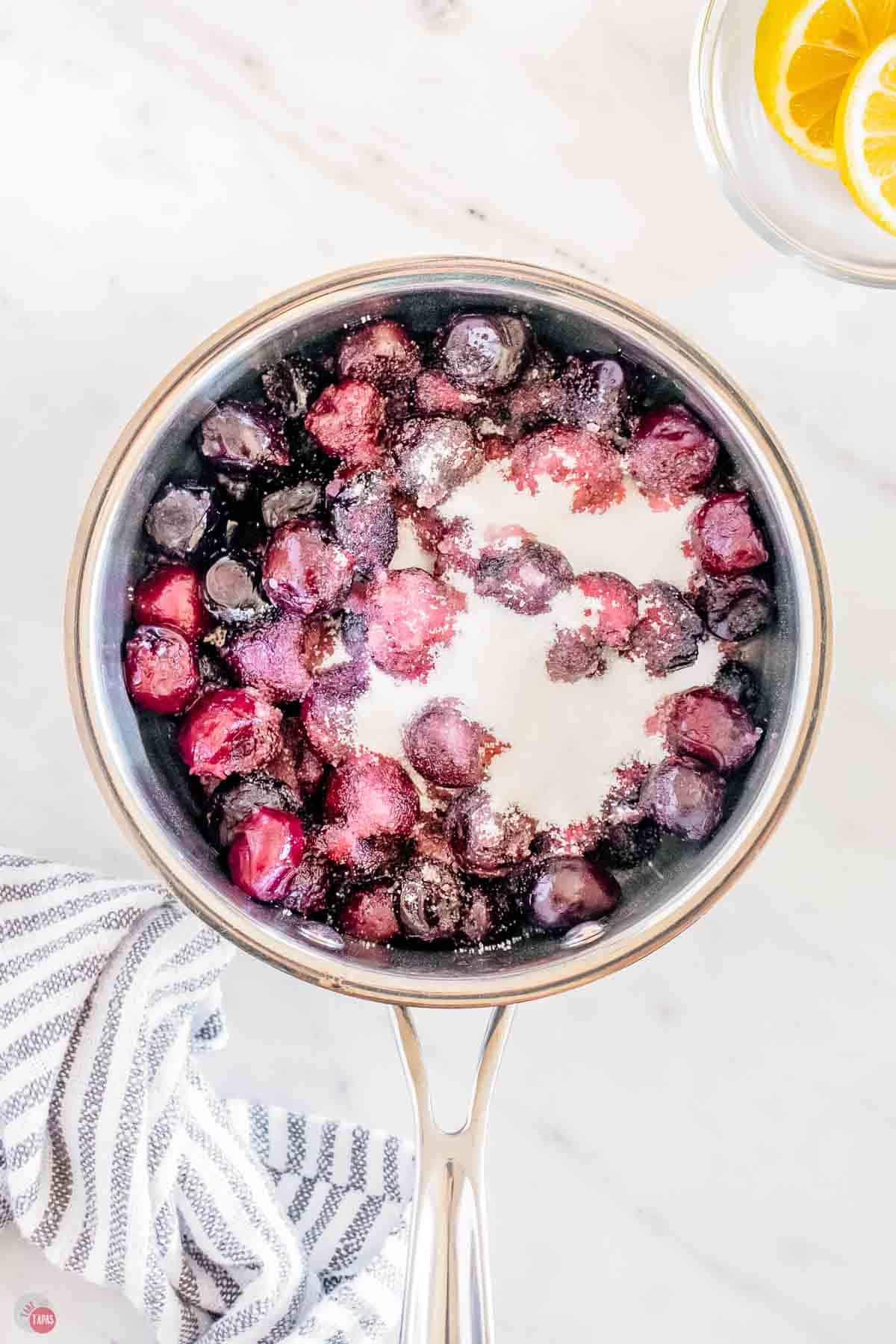 pot of cherries and sugar
