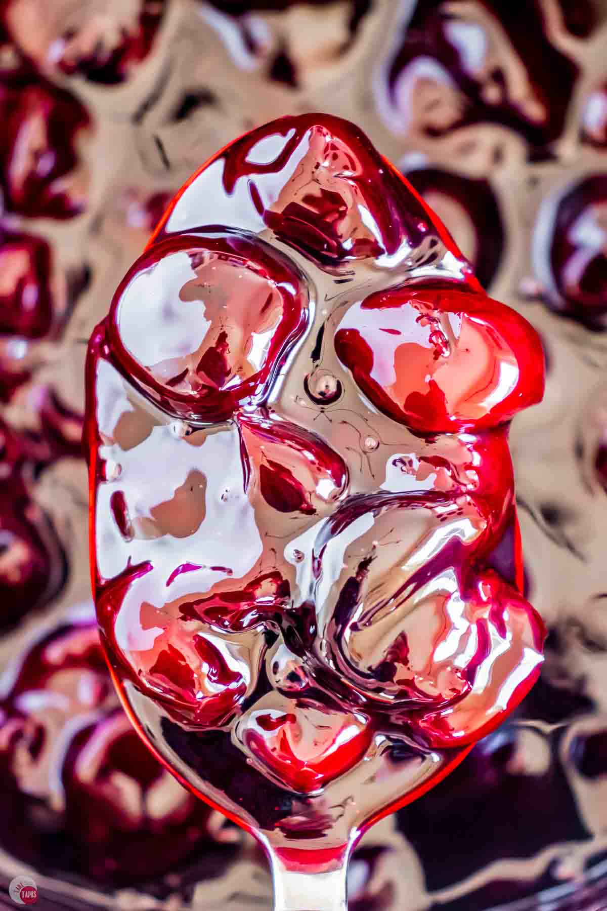 close up of spoon of homemade cherry pie filling