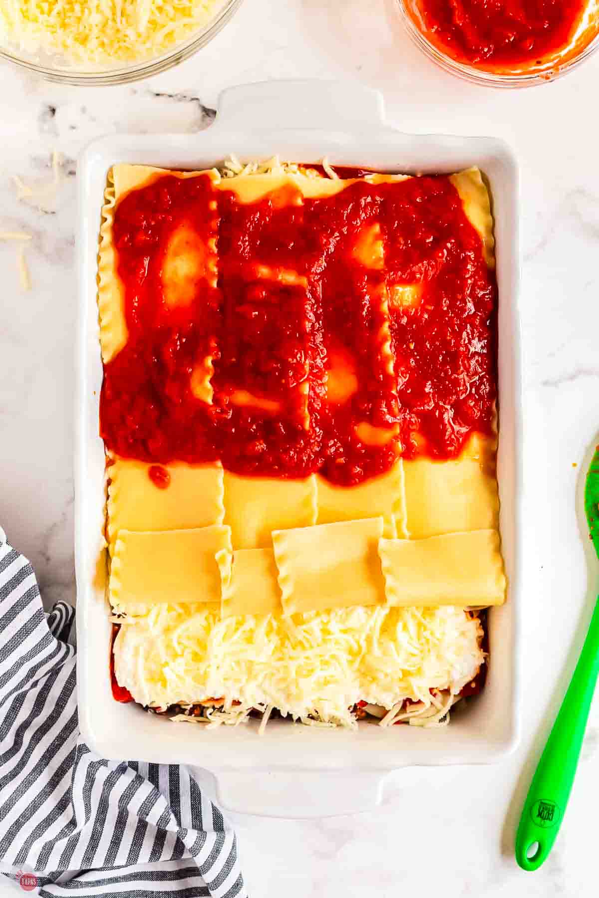 last layer of lasagna noodles topped with tomato sauce