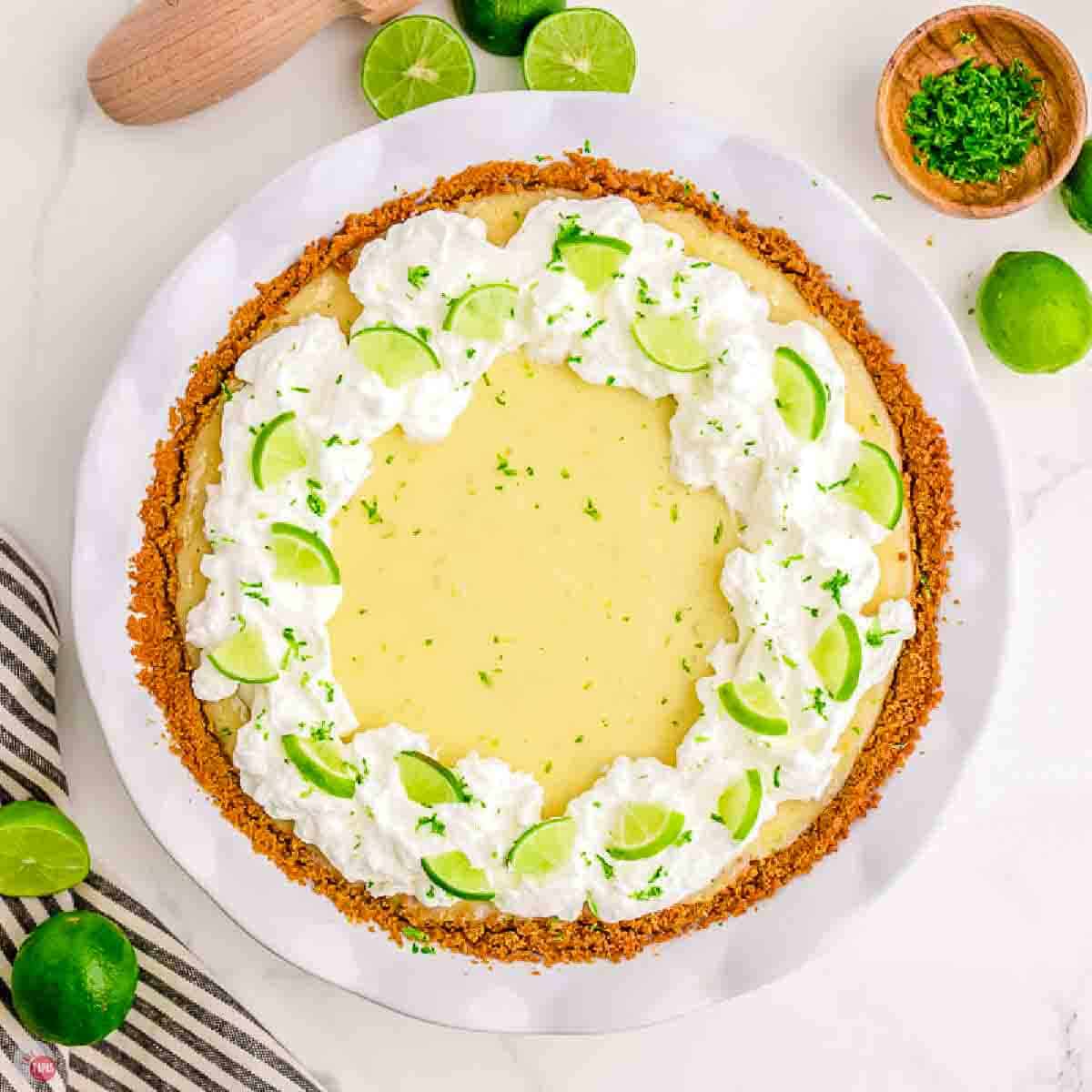 overhead picture of key lime pie garnished with whipped cream