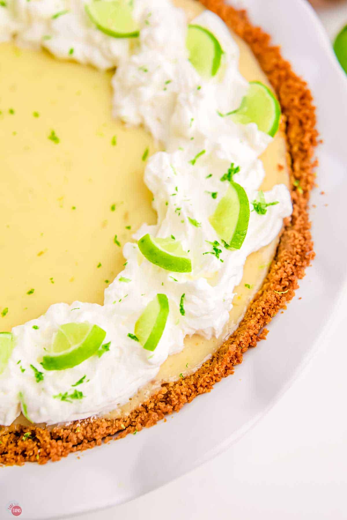 close up of edge of a pie with cool whip on top