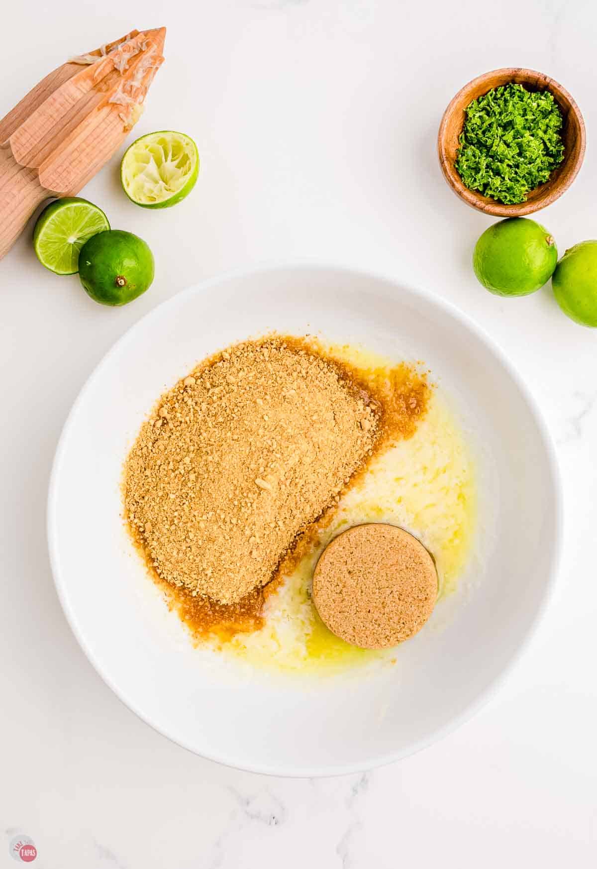 graham cracker crumbs and melted butter in a pie plate