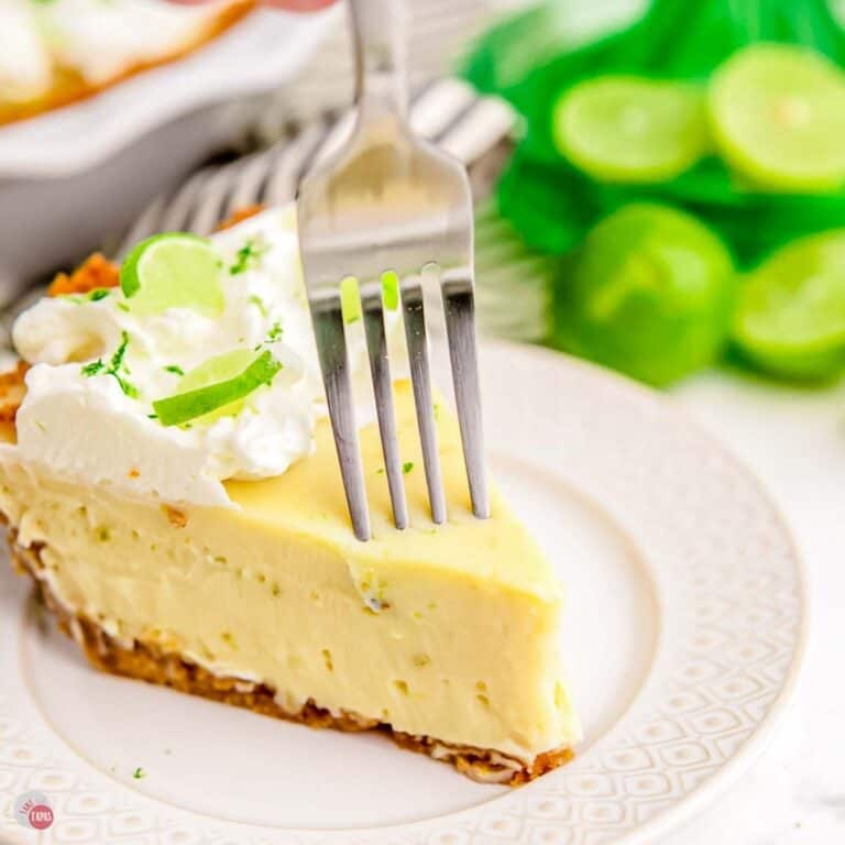slice of key lime pie on a plate with a fork