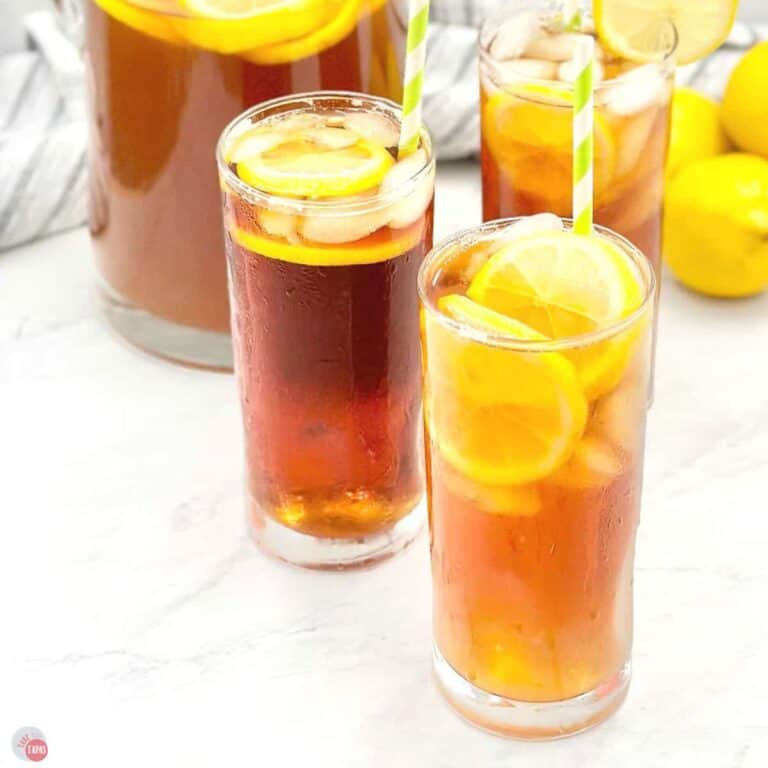 close up of lemon iced tea in tall glasses with straws