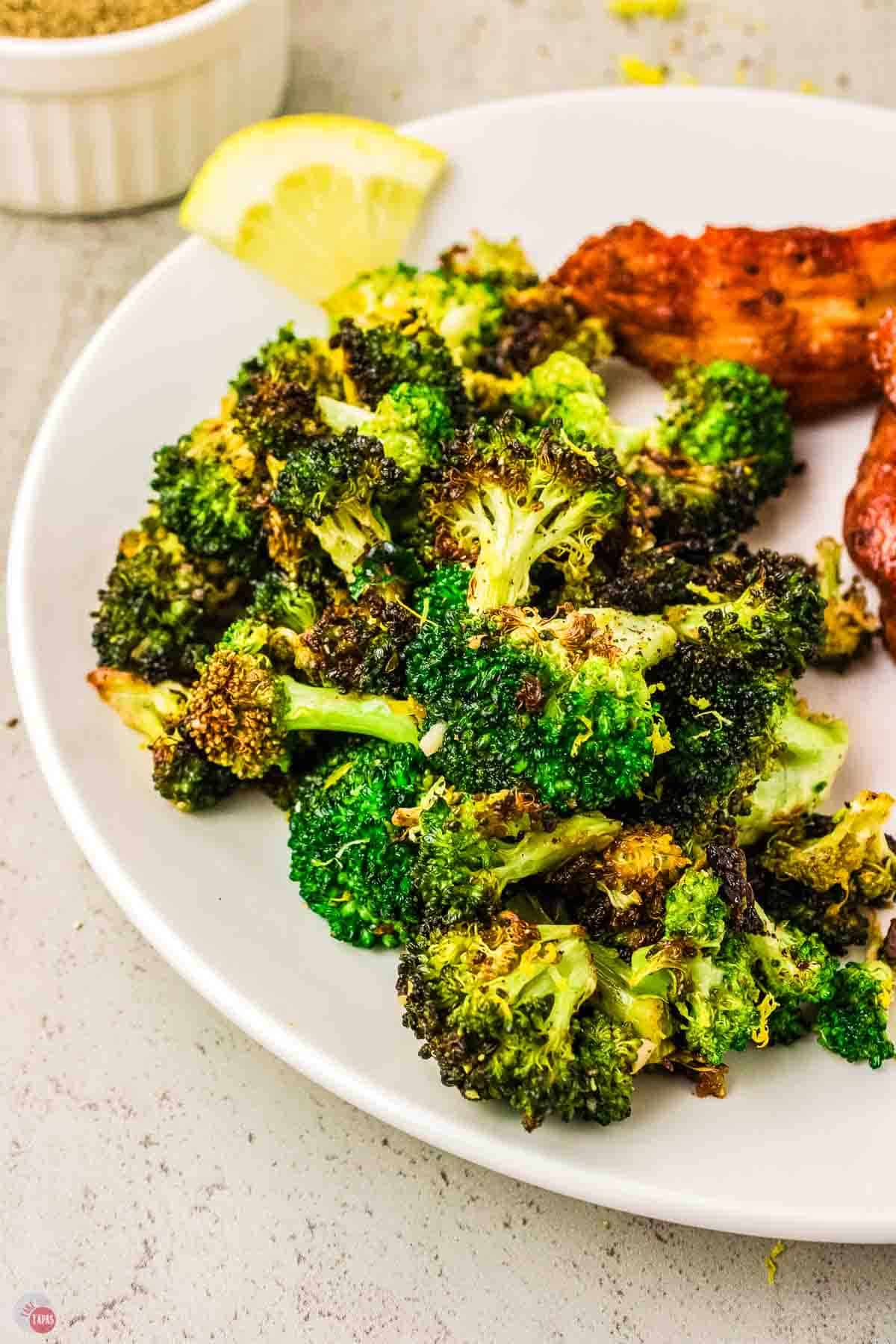 plate of roasted broccoli with lemon